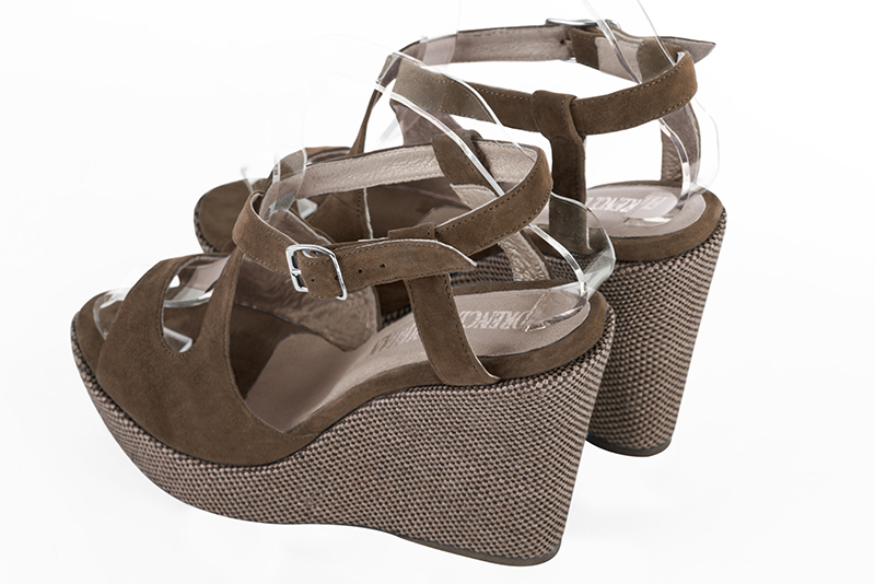 Chocolate brown women's open back sandals, with crossed straps. Round toe. Very high wedge soles. Rear view - Florence KOOIJMAN